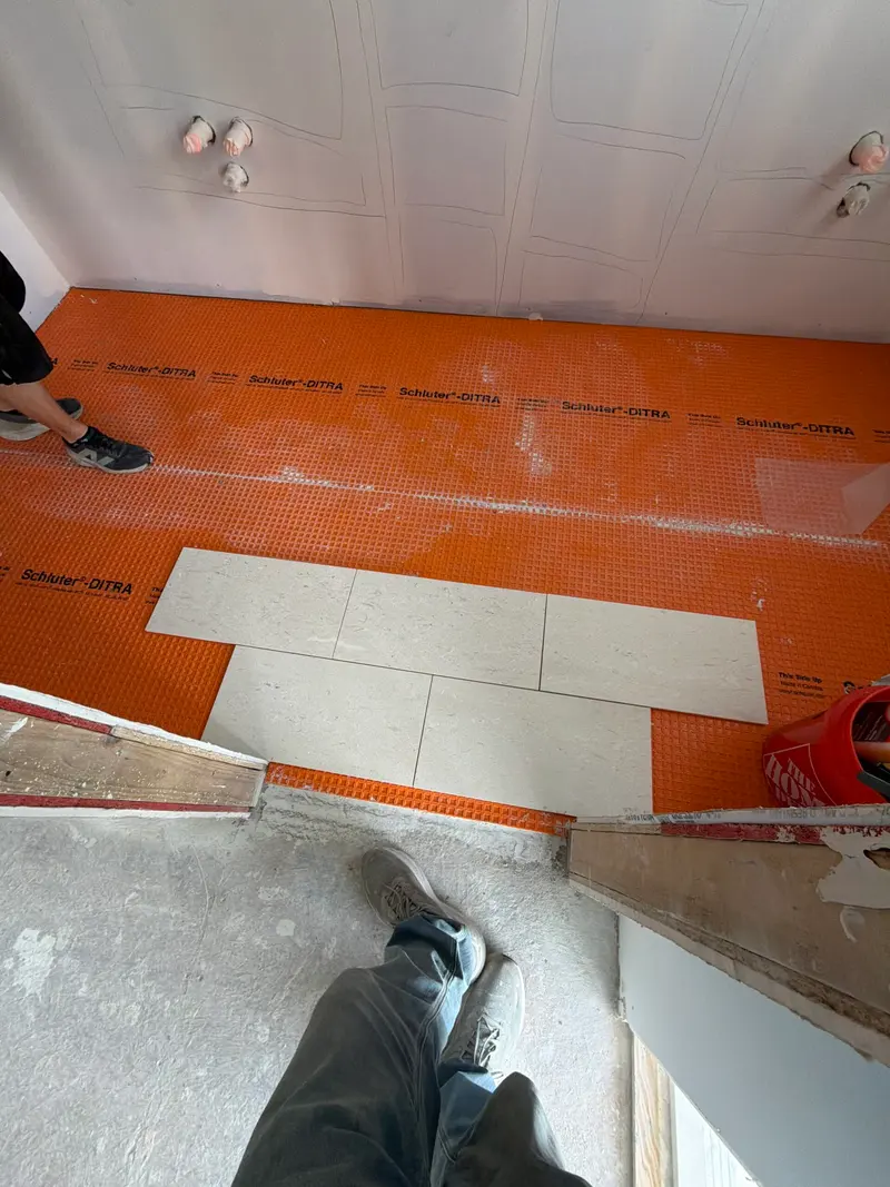 Waterproofing membrane installed before tile in a bathroom remodel