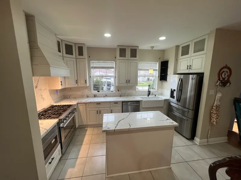 Open-plan kitchen with new cabinetry