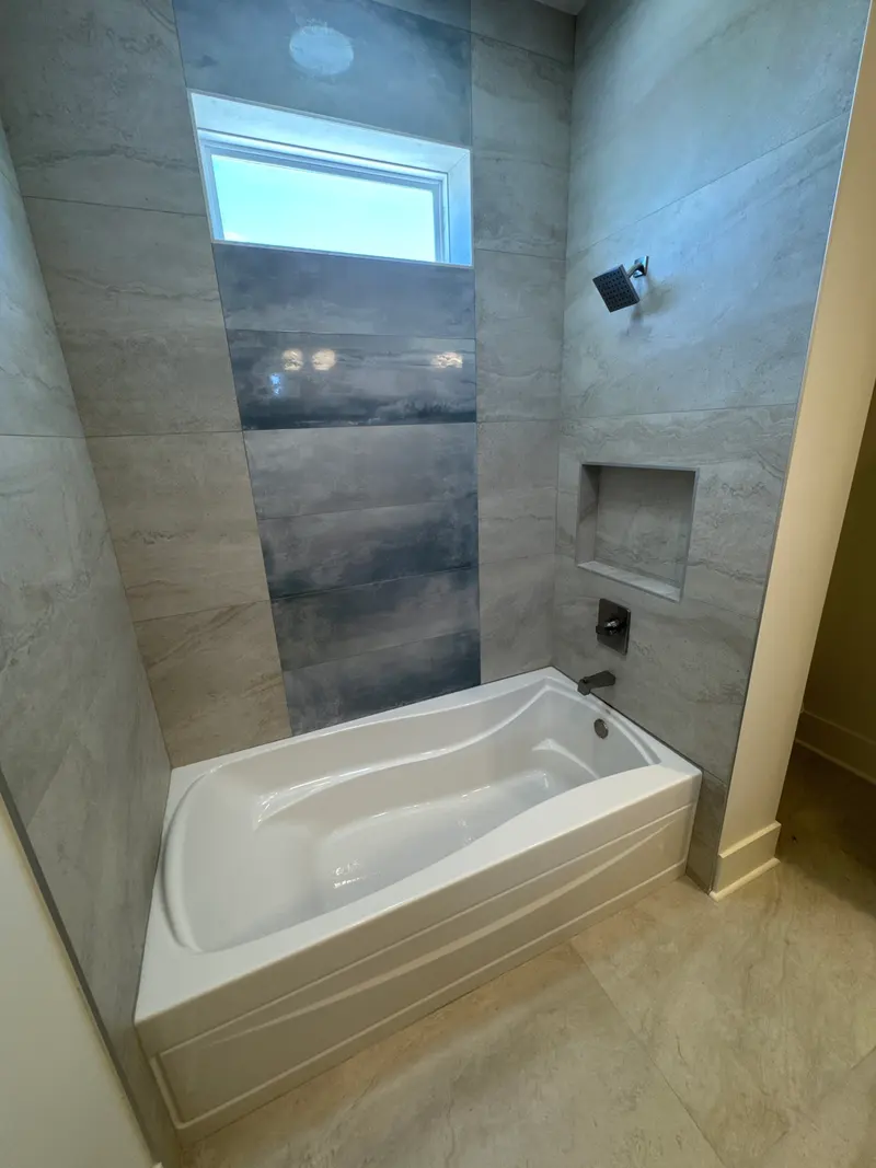 Tiled tub and shower with recessed niche