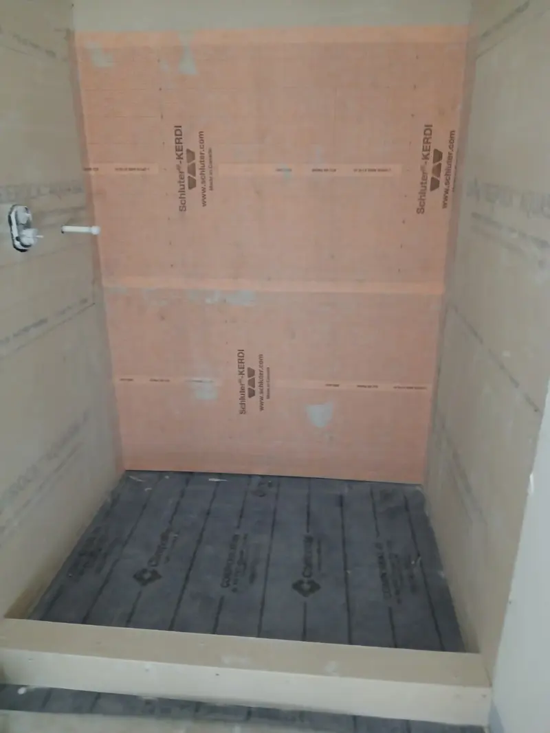 Shower floor prepared with waterproofing